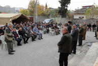 Relatives of Maryam Nouri, a 24-year-old Iraqi Kurdish woman, mourn her death at a wake outside the family home in the town of Soran in the Kurdish semi-autonomous region of northern Iraq, Sunday, Nov. 28, 2021. Nouri, called Baran by her friends and family, drowned this week along with at least 26 others in the English Channel as she was trying to make the illegal crossing to reunite with her fiancée in the United Kingdom. (AP Photo/Hussein Ibrahim)