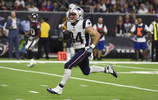 Rex Burkhead makes a preseason house call. (AP Photo/Eric Christian Smith)