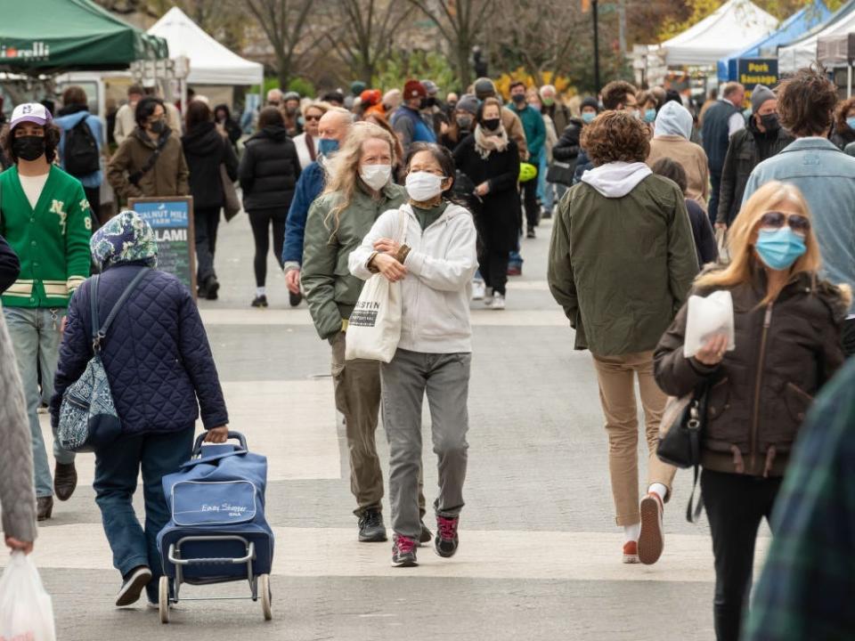 People wearing face masks shopping at the farmers' market in Union Square in Manhattan.