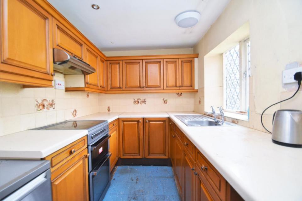 Eastern Daily Press: The existing kitchen is fitted with wooden cabinets and worktops but needs some TLC