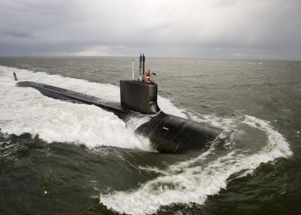 In this file photo taken Nov. 26, 2009, the Virginia-class attack submarine Pre-Commissioning Unit New Mexico undergoes trials in the Atlantic. A US couple has been arrested in the state of West Virginia for allegedly selling information on nuclear warships to what they believed was a foreign state, the Justice Department said on Oct. 10, 2021. Jonathan Toebbe, who worked as a nuclear engineer for the US Navy, and his wife Diana were arrested by Federal Bureau of Investigation agents on Saturday and charged with violating the Atomic Energy Act in a criminal complaint, the Justice Department said in a statement.