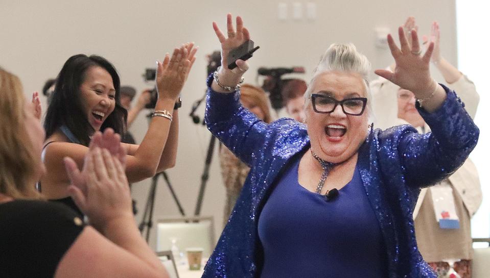 Opening keynote speaker Pegine makes her grand entrance through the excited crowd at the 2023 Boss Lady Women's :Leadership Conference on Thursday, Sept. 14, 2023 at the Daytona Grande Oceanfront Resort in Daytona Beach.