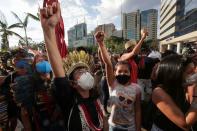 Indigenous Brazilians take part in a protest to defend the demarcation of indigenous lands, in Brasilia