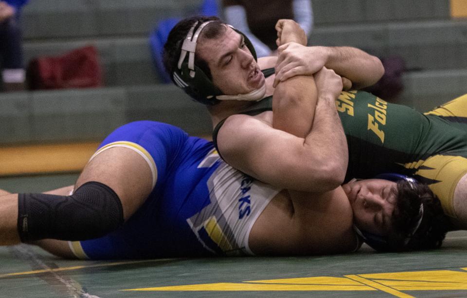 Eric Mathies of St. Mary Catholic Central pins Ida's Alex Giarmo at 190 pounds during the SMCC Falcon Duals Saturday.