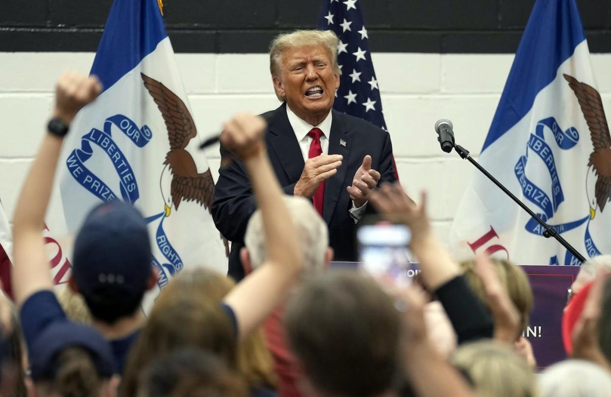 Former President Donald Trump reacts as he visits with campaign volunteers in Des Moines, Iowa this month. (AP Photo/Charlie Neibergall)