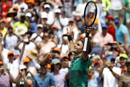 Apr 2, 2017; Key Biscayne, FL, USA; Roger Federer of Switzerland celebrates after his match against Rafael Nadal of Spain in the men's singles championship of the 2017 Miami Open at Crandon Park Tennis Center. Mandatory Credit: Geoff Burke-USA TODAY Sports