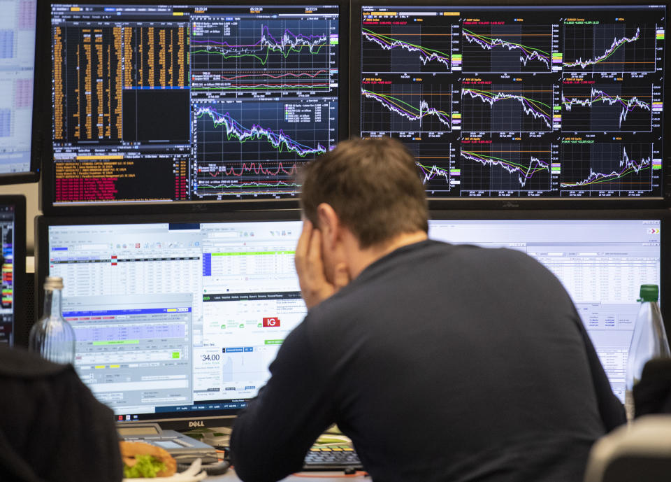 28 February 2020, Hessen, Frankfurt/Main: An exchange trader at the Frankfurt Stock Exchange looks at his monitors. The most important German leading index, the Dax, fell by more than 5 percent in the morning. Concerns about a corona epidemic have been weighing on financial markets worldwide for days. Photo: Boris Roessler/dpa (Photo by Boris Roessler/picture alliance via Getty Images)