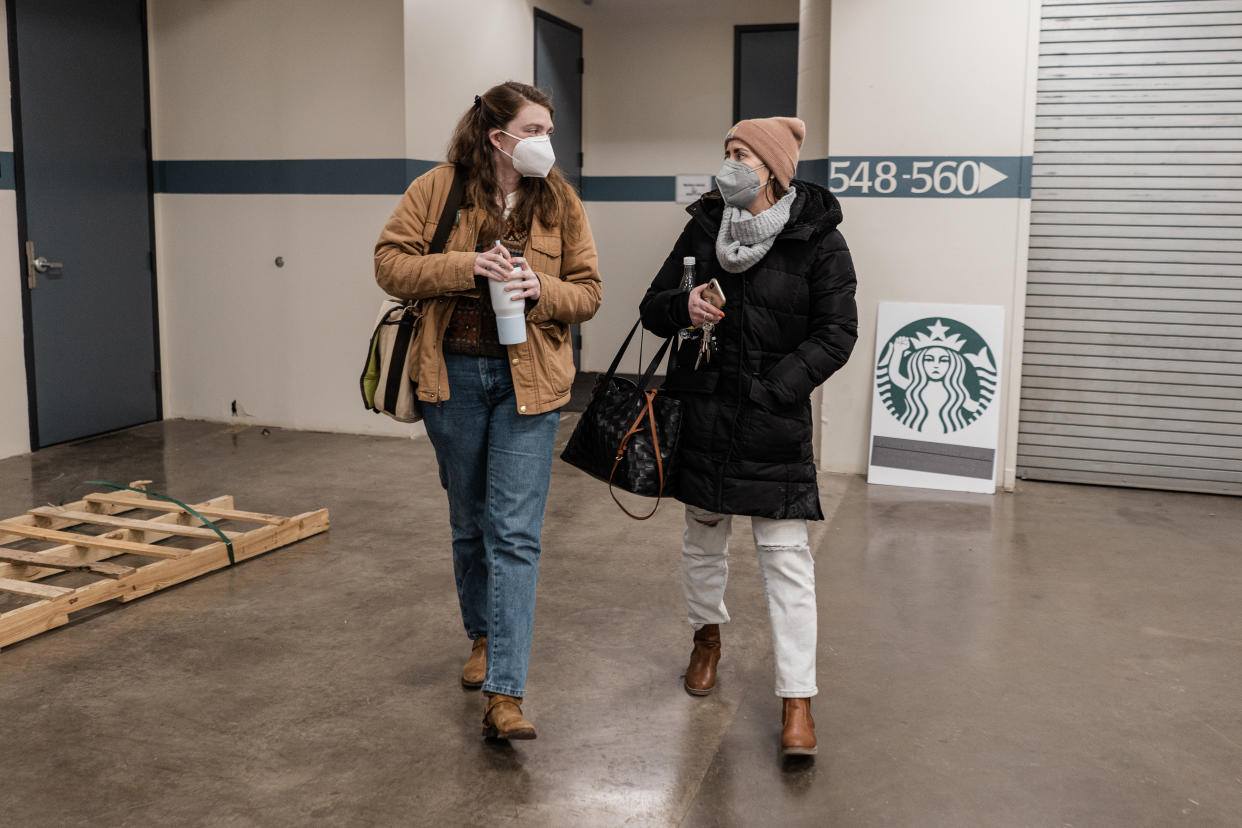 BUFFALO, NY - JANUARY 30:
Michelle Eisen and Jaz Brisack chat, leaving the Starbucks Workers United organizing office after a bargaining training discussion led by Richard Bensinger over Zoom in Buffalo on January 30, 2022. (Photo by Libby March for The Washington Post via Getty Images)