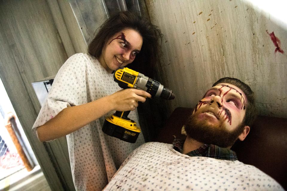 Bailey Skinner, left, poses with Knox News downtown reporter Ryan Wilusz in October 2018 after he received a makeover to see how actors at FrightWorks in Powell transform into their characters.