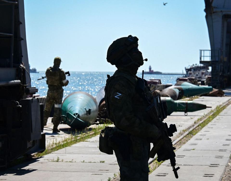 Russian servicemen patrol a territory of the sea port in the city of Mariupol on June 12, 2022. (Yuri Kadobnov/AFP via Getty Images)