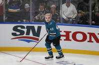 San Jose Sharks' Tomas Hertl wears a Justin Bieber mask during the Skills Competition, part of the NHL All-Star weekend, Friday, Jan. 24, 2020, in St. Louis. (AP Photo/Jeff Roberson)