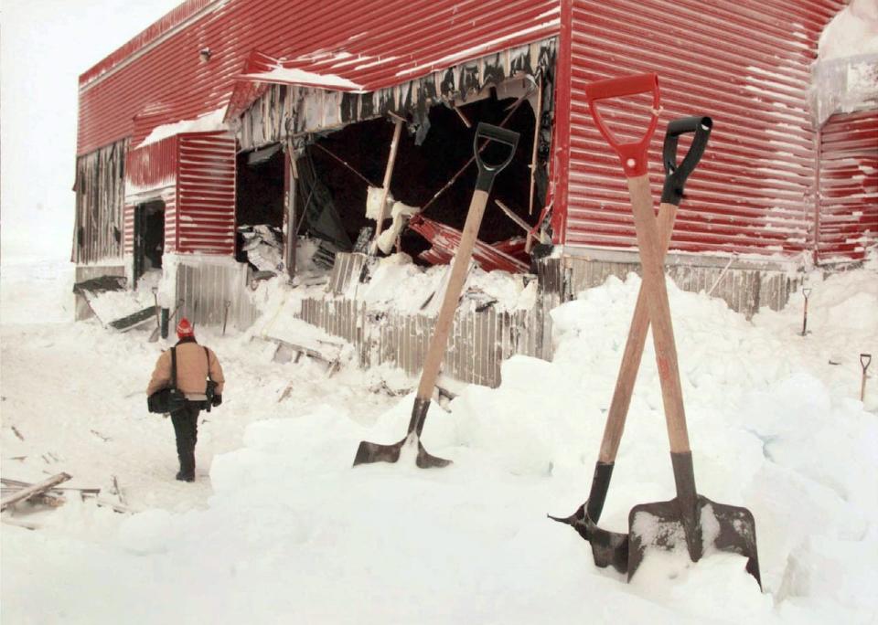 KANGIQSUALUJJUAQ, Que., Jan. 2, 1999. Shovels line the outside of the gymnasium of the school in Kangiqsualujjaq, Que. Saturday where an avalanche of snow from the hill behind crashed in killing nine people during a New Year celebration early Friday morning. 