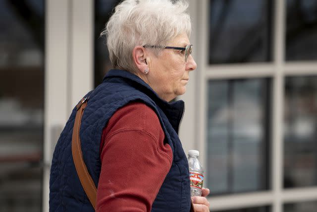 <p>Mark Henle/The Arizona Republic via AP</p> Wanda Kelly, George Alan Kelly's wife, leaves Nogales Justice Court in Arizona, following his preliminary hearing, Feb. 22, 2023.