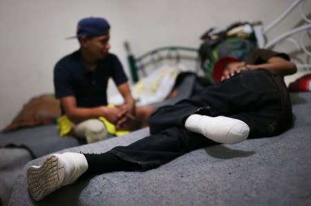 Migrants who lost legs attend a rehabilitation program
