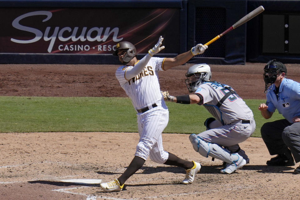 San Diego Padres' Xander Bogaerts watches his two-run home run hit during the sixth inning of a baseball game against the Miami Marlins, Wednesday, Aug. 23, 2023, in San Diego. (AP Photo/Gregory Bull)