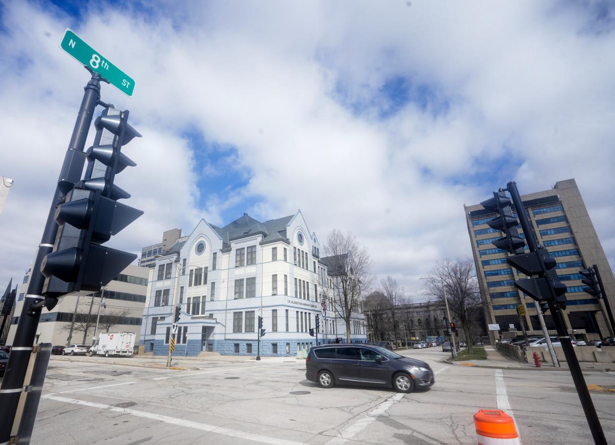 Downtown's Michigan Street will have its car and parking lanes reduced to provide space for protected bike lanes, a median strip and other changes.