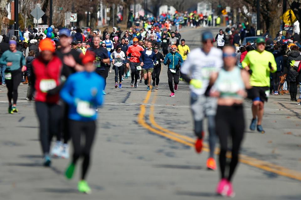 Runners make their way down Rockdale Avenue during the 2023 New Bedford Half-Marathon.