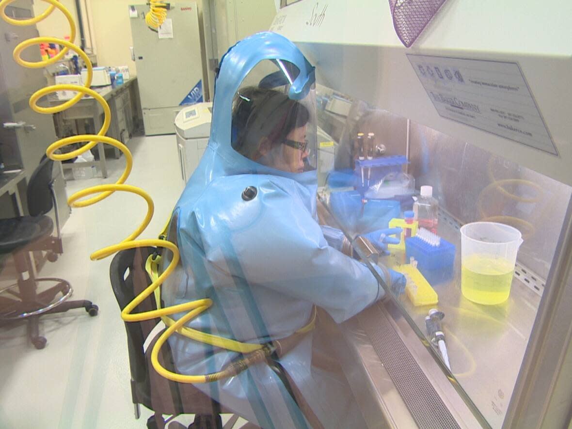 Dr. Xiangguo Qiu, seen here in an undated screengrab from a CBC segment, at the National Microbiology Laboratory (NML) in Winnipeg. (CBC - image credit)