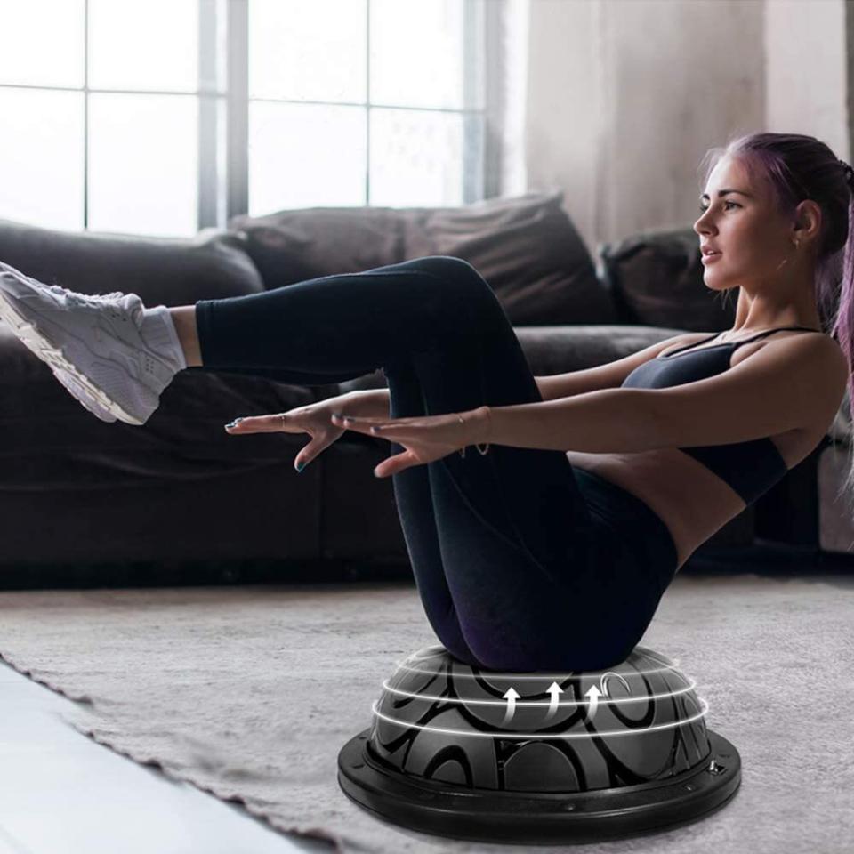 Do planks, pushups, squats and lunges on this piece of equipment, which basically fits anywhere indoors. <br /><br /><strong>Promising review:</strong> "I recently went to a couple classes at my local gym and the instructor let us use these exercise balls. I couldn&rsquo;t believe how sore I was the next day! It was a good sore! I was hooked and immediately started searching for one on Amazon to have in my own home. This one seemed like a good price point and I liked that it also came with the resistance bands. I&rsquo;ve used this exercise ball for the past several days in a row now and I have to say, I love it!" &mdash; <a href="https://amzn.to/3wgDJBp" target="_blank" rel="nofollow noopener noreferrer" data-skimlinks-tracking="5762934" data-vars-affiliate="Amazon" data-vars-asin="none" data-vars-href="https://www.amazon.com/gp/customer-reviews/R38OQ68IROQYWZ?tag=bfgenevieve-20&amp;ascsubtag=5762934%2C17%2C33%2Cmobile_web%2C0%2C0%2C15993451" data-vars-keywords="cleaning,fast fashion" data-vars-link-id="15993451" data-vars-price="" data-vars-product-id="1" data-vars-product-img="none" data-vars-product-title="Placeholder- no product" data-vars-retailers="Amazon">Kayla<br /><br /></a><strong><a href="https://amzn.to/3yfe6D0" target="_blank" rel="noopener noreferrer">Get it from Amazon for $56.99+ (available in five colors).</a></strong><br /><a href="https://img.buzzfeed.com/buzzfeed-static/static/2020-11/4/16/asset/cd46d45638ee/sub-buzz-3388-1604507919-19.jpg" data-skimlinks-tracking="5762934"></a>