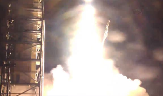 The ORS-3 mission blasts off the launchpad in a blaze of fire on Nov. 19, 2013, carrying a record-breaking 29 satellites to orbit.