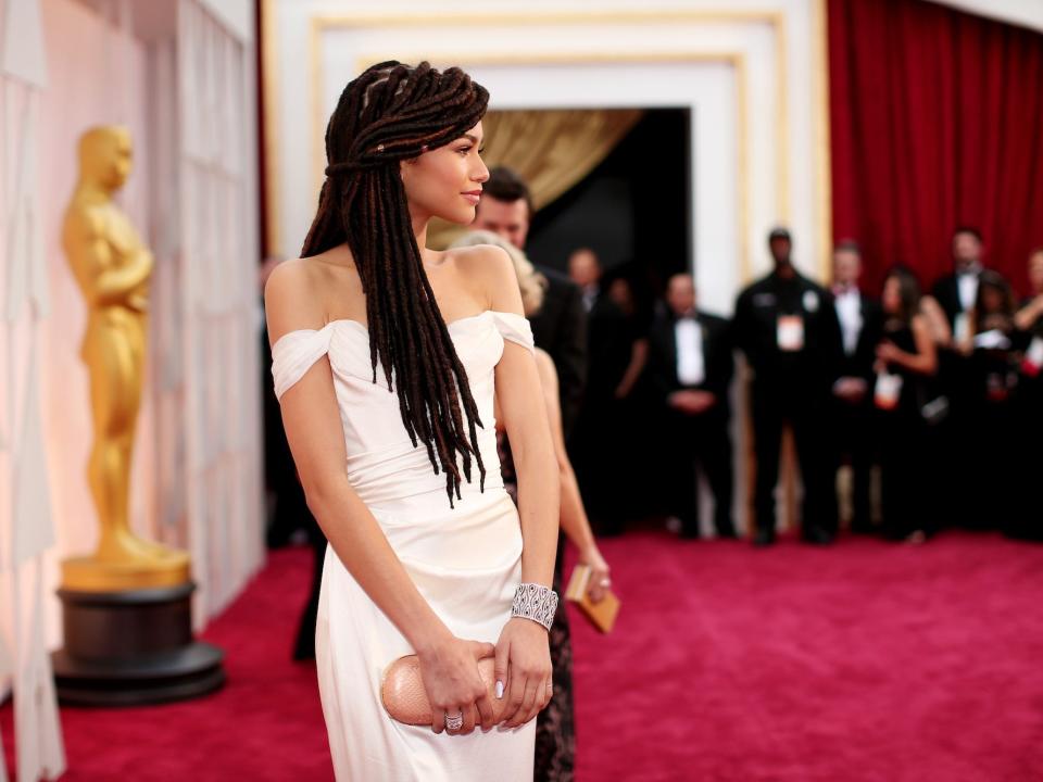 Zendaya in a white dress on the 2015 Oscars red carpet