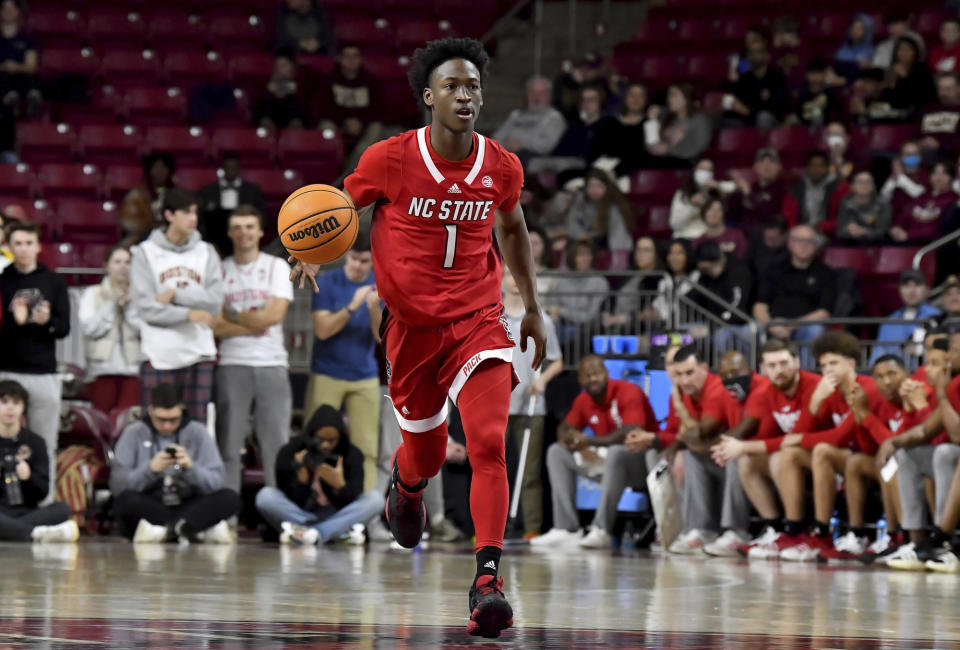 North Carolina State's Jarkel Joiner (1) dribbles the ball into Boston College territory during the first half of an NCAA college basketball game, Saturday, Feb. 11, 2023, in Boston. (AP Photo/Mark Stockwell)