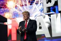 Former President Donald Trump applauds supporters prior to speaking at a Turning Point Action gathering, Saturday, July 24, 2021, in Phoenix. (AP Photo/Ross D. Franklin)