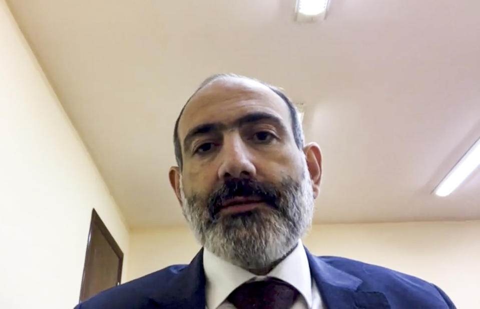 This fame grab taken from a video published on Armenian Prime Minister Nikol Pashinyan FaceBook official account @nikol.pashinyan, showing Armenian Prime Minister Nikol Pashinyan addressing the nation in unknown location in Armenia, Tuesday, Nov. 10, 2020. Armenia and Azerbaijan announced an agreement early Tuesday to halt fighting over the Nagorno-Karabakh region of Azerbaijan under a pact signed with Russia that calls for deployment of nearly 2,000 Russian peacekeepers and territorial concessions. (@nikol.pashinyan, Armenian Prime Minister official Facebook account via AP)