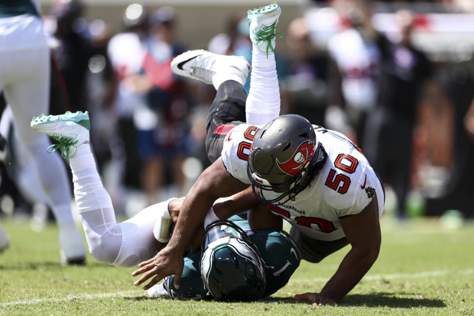 TAMPA, FL - SEPTEMBER 29: Vita Vea #50 of the Tampa Bay Buccaneers sacks Jalen Hurts #1 of the Philadelphia Eagles during the first quarter of an NFL football game at Raymond James Stadium on September 29, 2024 in Tampa, Florida. (Photo by Kevin Sabitus/Getty Images)