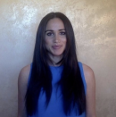 <p>For a rousing address given over the summer for the digital Girl Up Leadership Summit, Meghan wore a bright blue sleeveless top and left her hair sleek, shiny, and straight. </p>