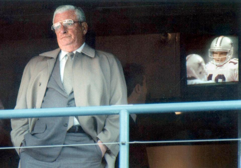 Art Model inthe owners box at the Stadium as Bernie Kosar, playing for the Dallas Cowboys after he was released from the Browns is on the television screen behind him in 1994.(Akron Beacon Journal file photo)