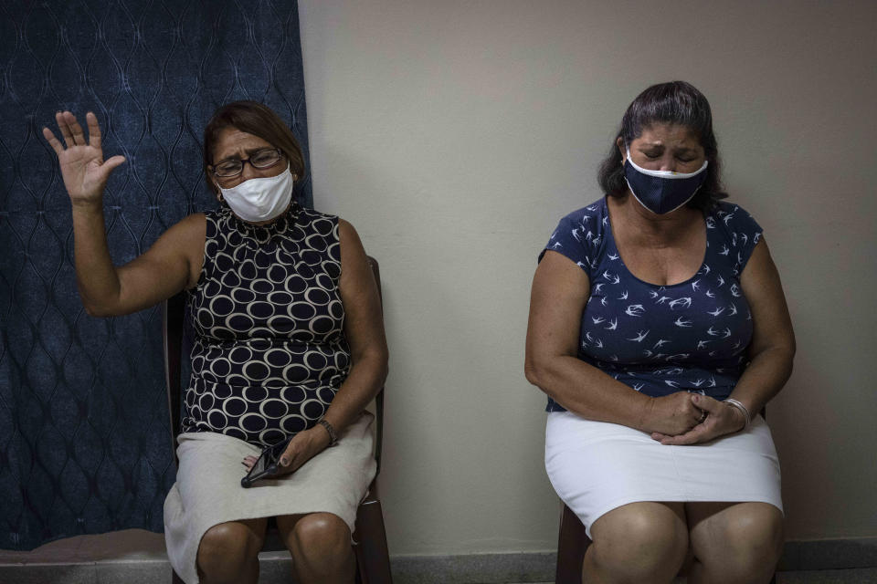 Evangelicals pray at church in Havana, Cuba, Tuesday, Oct. 12, 2021. The idea of same-sex marriage bothers many Pentecostal parishioners, who oppose a proposal to legalize it in Cuba, where Pentecostal churches have been growing. (AP Photo/Ramon Espinosa)