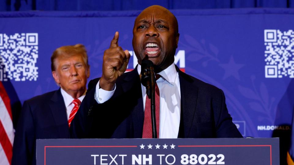 PHOTO: Sen. Tim Scott speaks as former President Donald Trump looks on during a campaign rally at the Grappone Convention Center in Concord, NH, Jan. 19, 2024. (Chip Somodevilla/Getty Images, FILE)