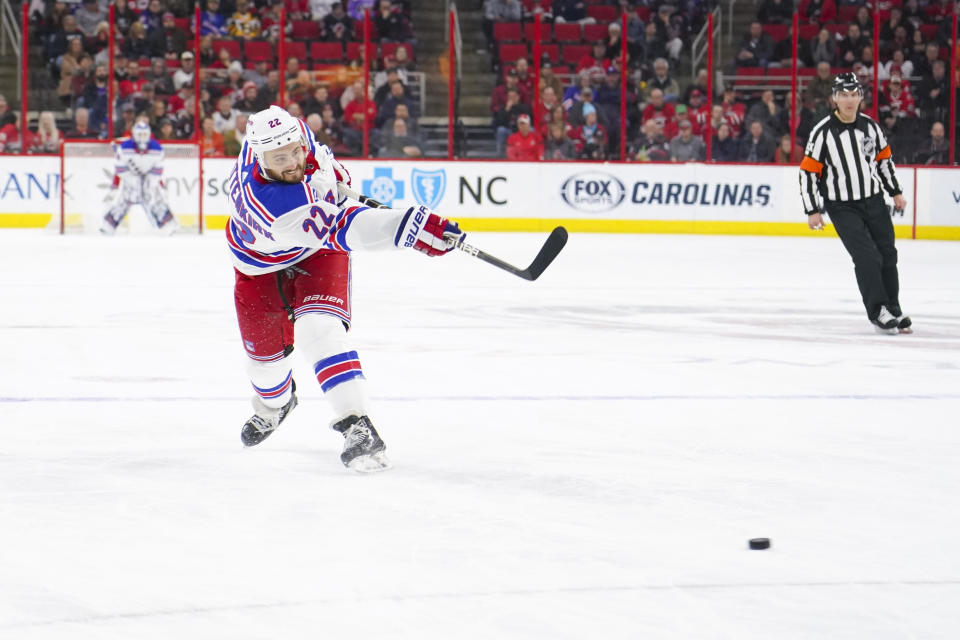 Feb 19, 2019; Raleigh, NC, USA;  New York Rangers defenseman Kevin Shattenkirk (22) takes a slap shot against the Carolina Hurricanes at PNC Arena. The New York Rangers defeated the Carolina Hurricanes 2-1. Mandatory Credit: James Guillory-USA TODAY Sports