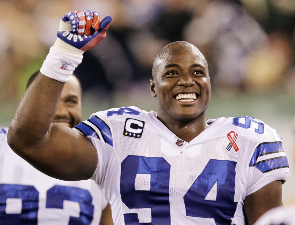 FILE - Dallas Cowboys quarterback DeMarcus Ware celebrates a touchdown to teammate Miles Austin during the second half of an NFL football game against the New York Jets Sunday, September 11, 2011, in East Rutherford, NJ DeMarcus Ware is a finalist for the Pro Football Hall of Fame Class of 2022 (AP Photo/Julio Cortez, File)