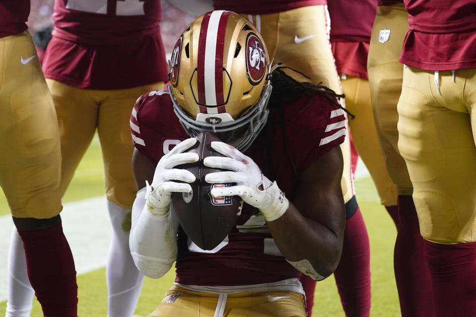 San Francisco 49ers linebacker Fred Warner celebrates after intercepting a pass during the second half of an NFL football game against the Dallas Cowboys in Santa Clara, Calif., Sunday, Oct. 8, 2023. | Godofredo A. Vásquez, Associated Press