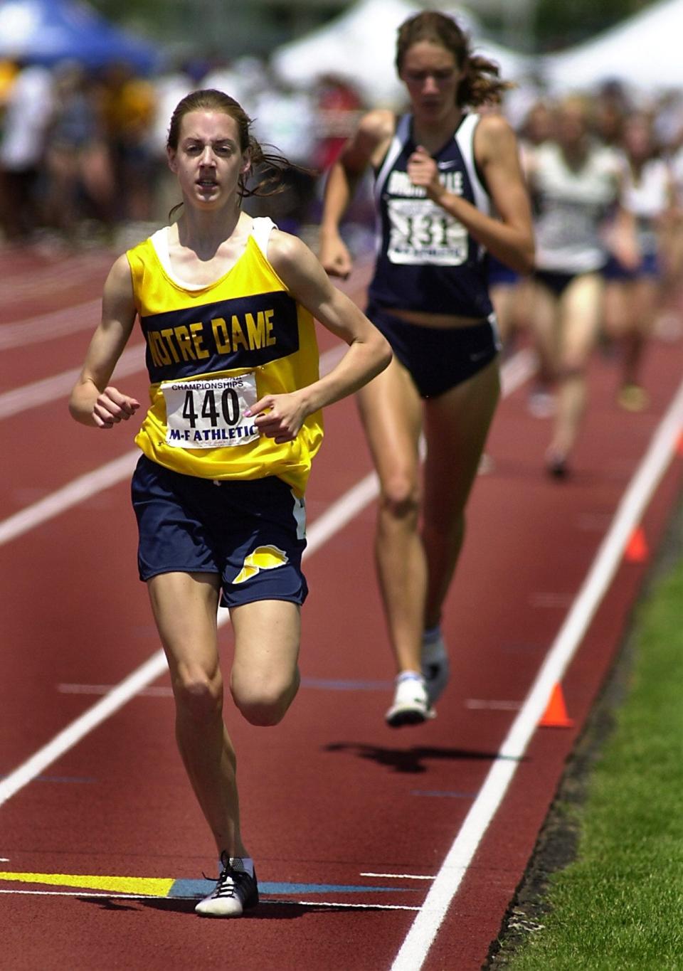 Molly Huddle closes in on a victory in the 1,500 meters at the 2002 New York State Public High School Athletic Association track and field championships.