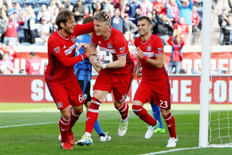 (From L) Chicago Fire's Joao Meira, Bastian Schweinsteiger and Nemanja Nikolic celebrate after scoring a goal during a MLS match in Bridgeview, Illinois, on April 1, 2017