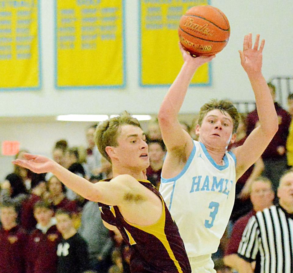 Hamlin's Easton Neuendorf (3) attempts to draw a foul from De Smet's Gannon Gruenhagen during a Lake Central Conference high school basketball doubleheader on Tuesday, Jan. 17, 2023 at the Hamlin Education Center.