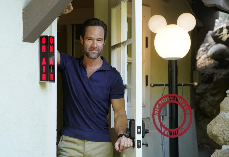 Actor and voiceover artist Chris Diamantopoulos poses for a portrait at his home studio in Los Angeles on Nov. 5, 2021. Diamantopoulos stars in the Netflix film "Red Notice." (AP Photo/Chris Pizzello)