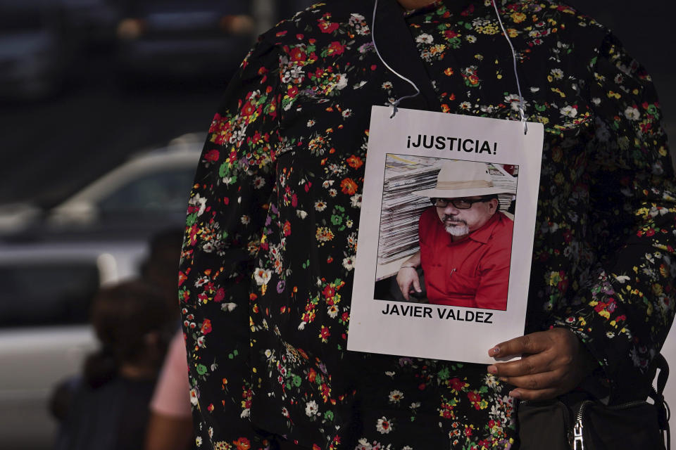 Griselda Triana holds a photo of her husband Javier Valdez who was murdered in Culiacan on May 15, 2017, during a protest to draw attention to the latest wave of murders of journalists, at the Angel of Independence monument in Mexico City, Monday, May 9. May 2022. Two journalists were shot dead in the state of Veracruz, on the coast of the Gulf of Mexico, on Monday, Yessenia Mollinedo Falconi and Sheila Johana García Olivera, director and reporter, respectively, of the online news site El Veraz in Cosoleacaque. (AP Photo/Marco Ugarte)