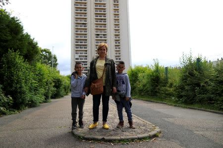 Fouzia Drief, kindergarten, poses with her twins Ryane and Rachad after an interview with Reuters at the Primary School Les Ormeaux in Montereau-Fault-Yonne near Paris, France, June 18, 2018. REUTERS/Gonzalo Fuentes/Files