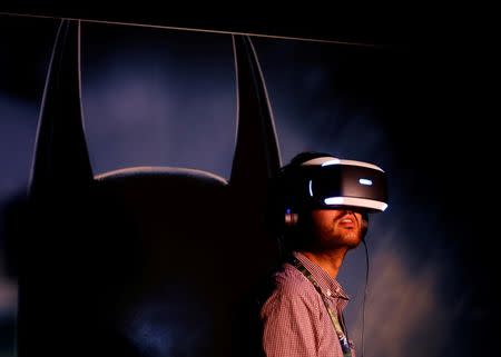 People try the new Sony VR headset during Sony Corporation's PlayStation 4 E3 2016 event in Los Angeles, California, U.S. June 13, 2016. REUTERS/Mike Blake