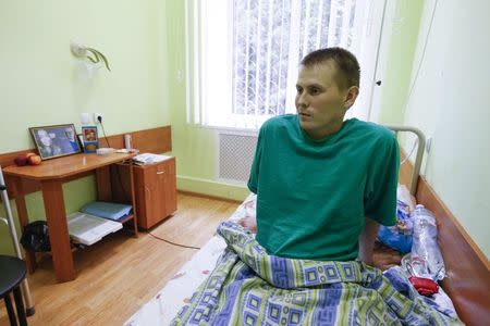 A man, who according to Ukraine's state security service (SBU) is named Alexander Alexandrov and is one of two Russian servicemen recently detained by Ukrainian forces, speaks during an interview with Reuters at a hospital in Kiev, Ukraine, May 28, 2015. REUTERS/Valentyn Ogirenko