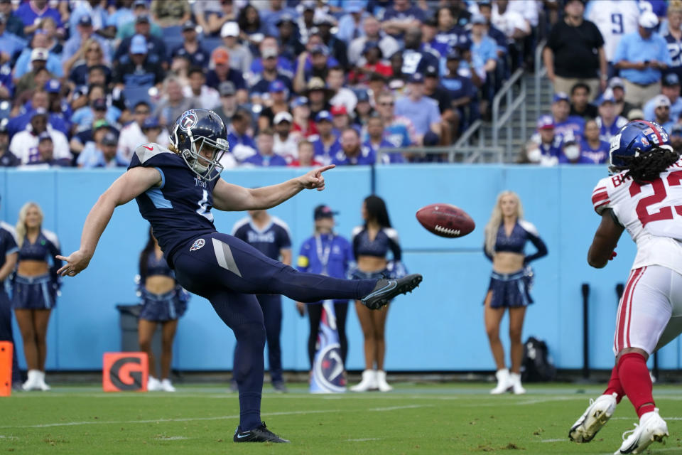 Tennessee Titans punter Ryan Stonehouse (4) kicks the ball away during the second half of an NFL football game against the New York Giants Sunday, Sept. 11, 2022, in Nashville. (AP Photo/Mark Humphrey)