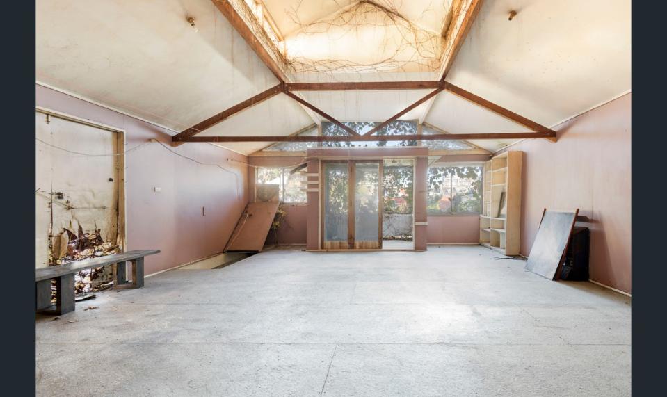 Loft of abandoned Redfern house up for sale, pictured here.