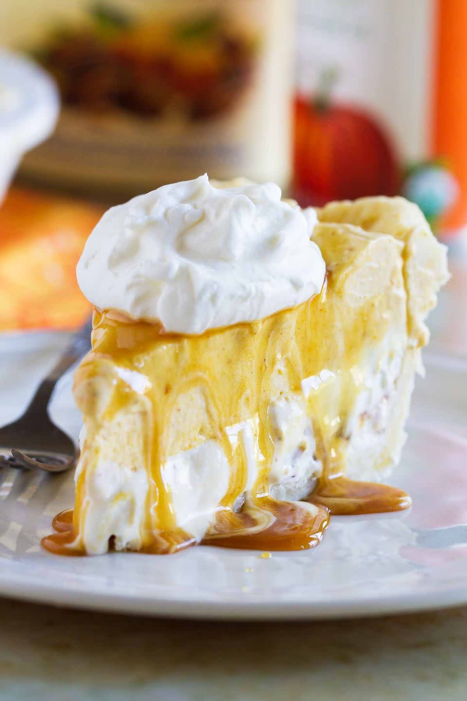<p>If a pumpkin pie, cheesecake, and ice cream pie were all blended together, you'd wind up with this glorious hybrid. Top it with caramel sauce for an extra-rich bite.</p><p><strong>Get the recipe at <a href="https://www.tasteandtellblog.com/pumpkin-butter-pecan-ice-cream-pie-recipe/" rel="nofollow noopener" target="_blank" data-ylk="slk:Taste and Tell;elm:context_link;itc:0;sec:content-canvas" class="link ">Taste and Tell</a>.</strong> </p>