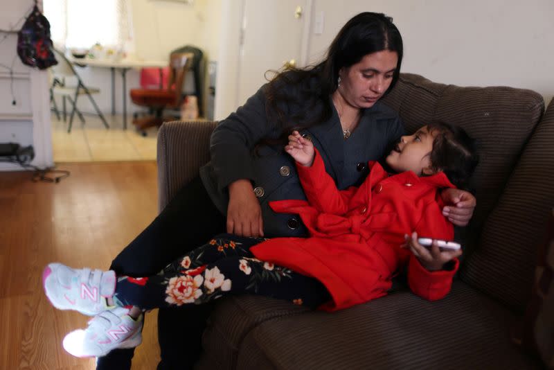Emiliana, 32, sits with her daughter Emily, 5, at their apartment in Los Angeles
