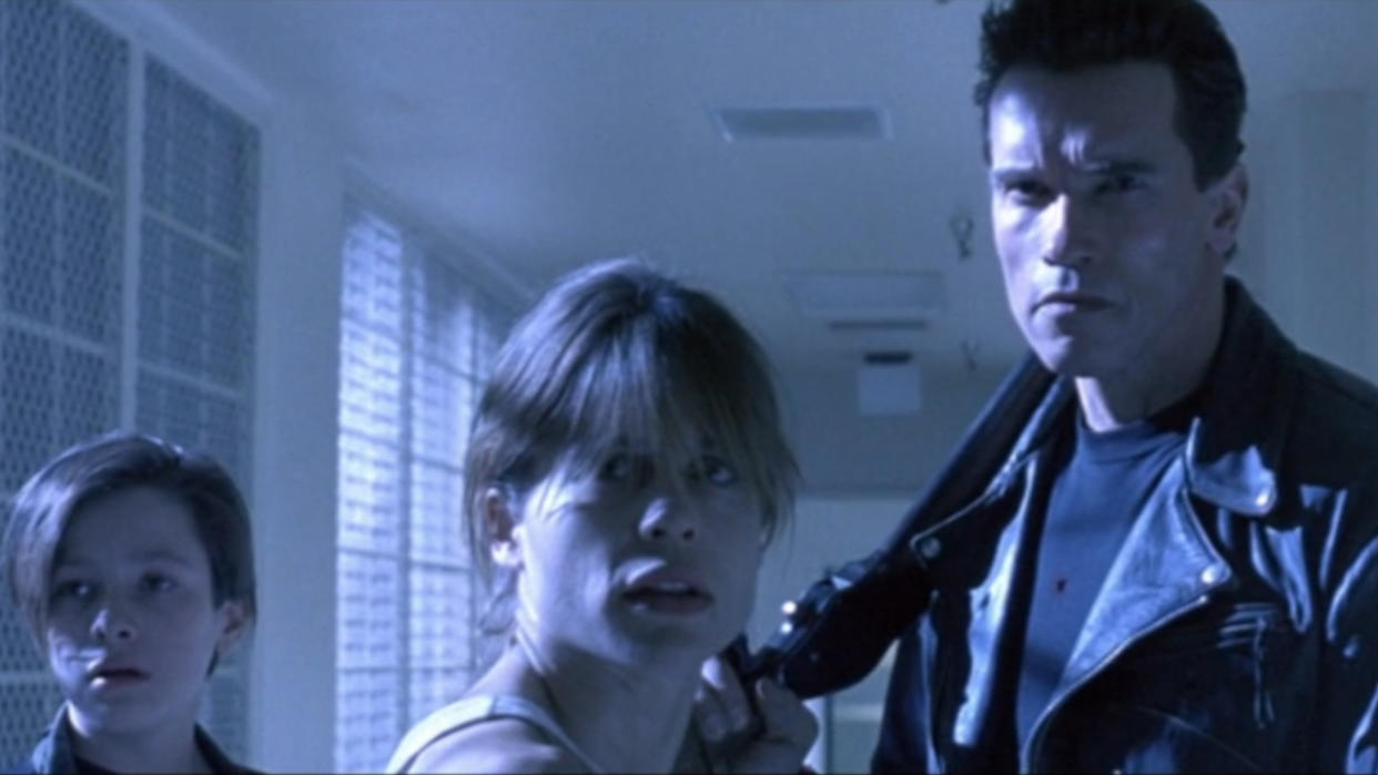  Edward Furlong, Linda Hamilton, and Arnold Schwarzenegger staring down a threat off camera in Terminator 2: Judgment Day. 