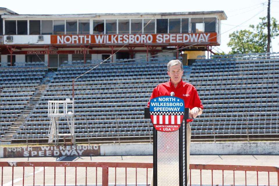 Gov. Roy Cooper speaks to media during a tour of North Wilkesboro Speedway on Tuesday, May 17.